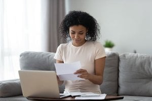 woman looking at Financial policy paper